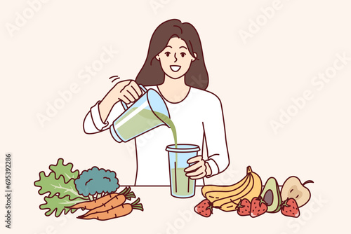 Woman drinks diet smoothie made in blender from organic fruits and vegetables with healthy vitamins. Cheerful girl uses detox diet to get rid of excess weight or harmful toxins in body