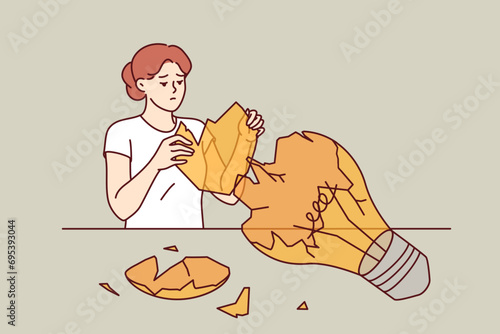 Broken light bulb near upset woman, as metaphor for destroyed idea and collapse of plans. Young Girl is trying to restore broken lightbulb, symbolizing idea that failed due to failure.