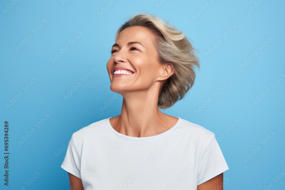 Portrait of a happy woman in her 40s sporting a breathable mesh jersey against a soft blue background. AI Generation Portrait of a happy woman in her 40s sporting a breathable mesh jersey against a soft blue background. AI Generation
