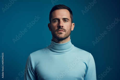 Portrait of a content man in his 30s showing off a thermal merino wool top against a soft blue background. AI Generation