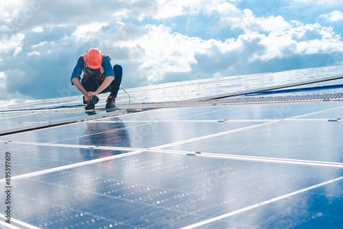 Male engineering teams install solar panels at solar power generating station, Professional engineer installing photovoltaic panel system using screwdriver, green energy and sustainable living