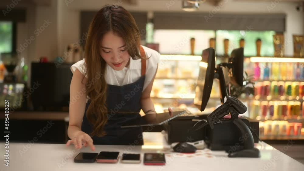 An Asian young Cashier woman working in supermarket An Asian young Cashier woman working in supermarket