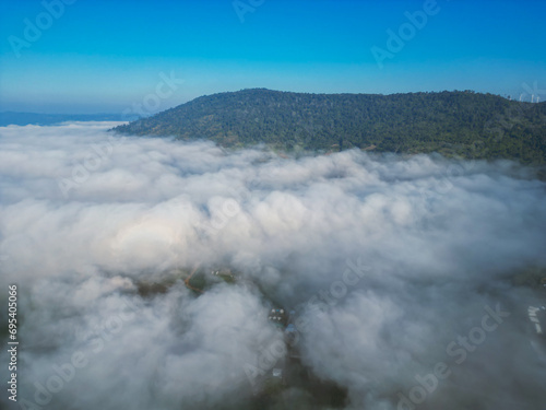 Aerial view  of flowing fog waves on mountain tropical rainforest.Khao Kho  Phetchabun  Thailand.