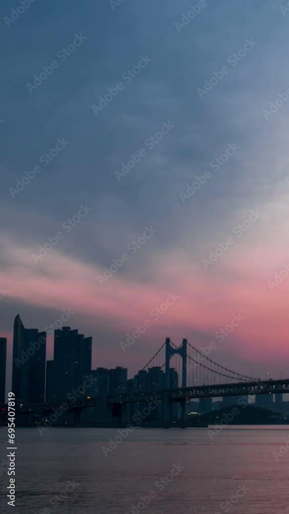 Gwangan Bridge on sunrise timelapse. Busan, South Korea. Camera pan Gwangan Bridge on sunrise timelapse. Busan, South Korea. Camera pan