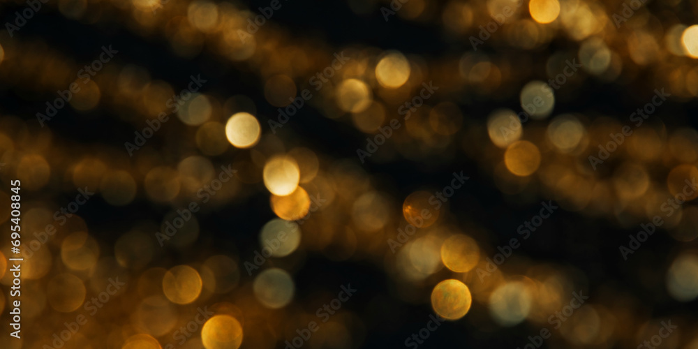 Abstract background of blurred yellow lights for design. Lights bokeh dis focus. Christmas background, copy space. Web banner - obrazy, fototapety, plakaty 