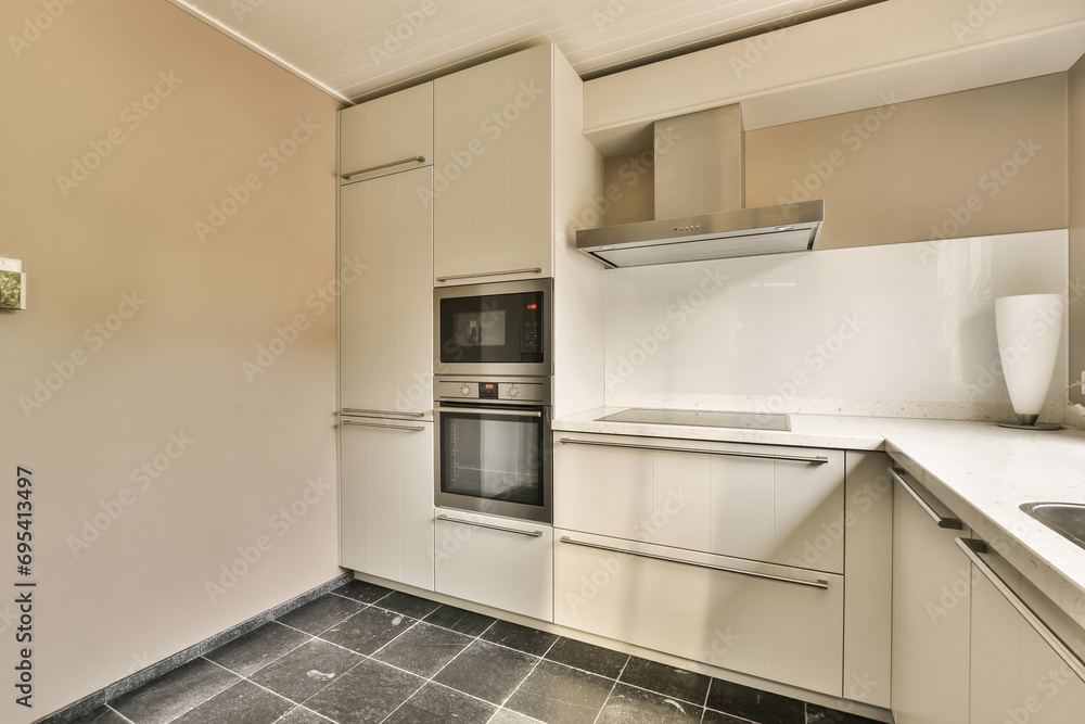 White kitchen with modern appliances White kitchen with modern appliances