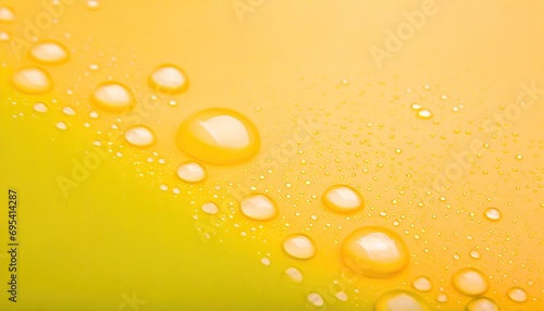 Water drops at yellow background.