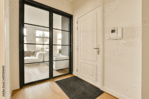 Living room with white walls and glass door