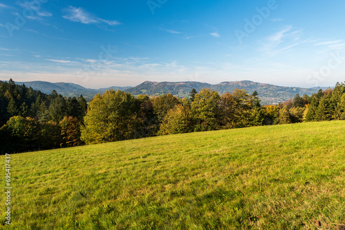 View from meadow above Malenovice village in Moravskoslezske Beskydy mountains in Czech republic photo