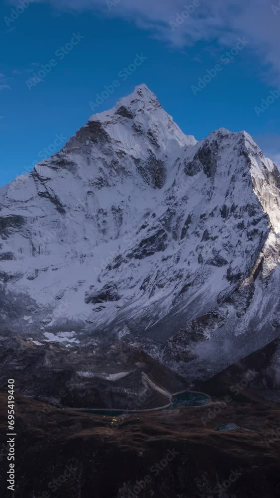 Ama Dablam Mountain. Blue Sky with Clouds. Himalaya, Nepal. Timelapse. Vertical Video Ama Dablam Mountain. Blue Sky with Clouds. Himalaya, Nepal. Timelapse. Vertical Video