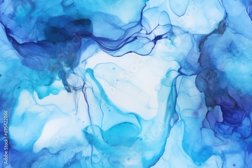  a close up view of a blue and white fluid paint textured with blue and white ink and ink smudges on the surface of the surface of the image. © Nadia