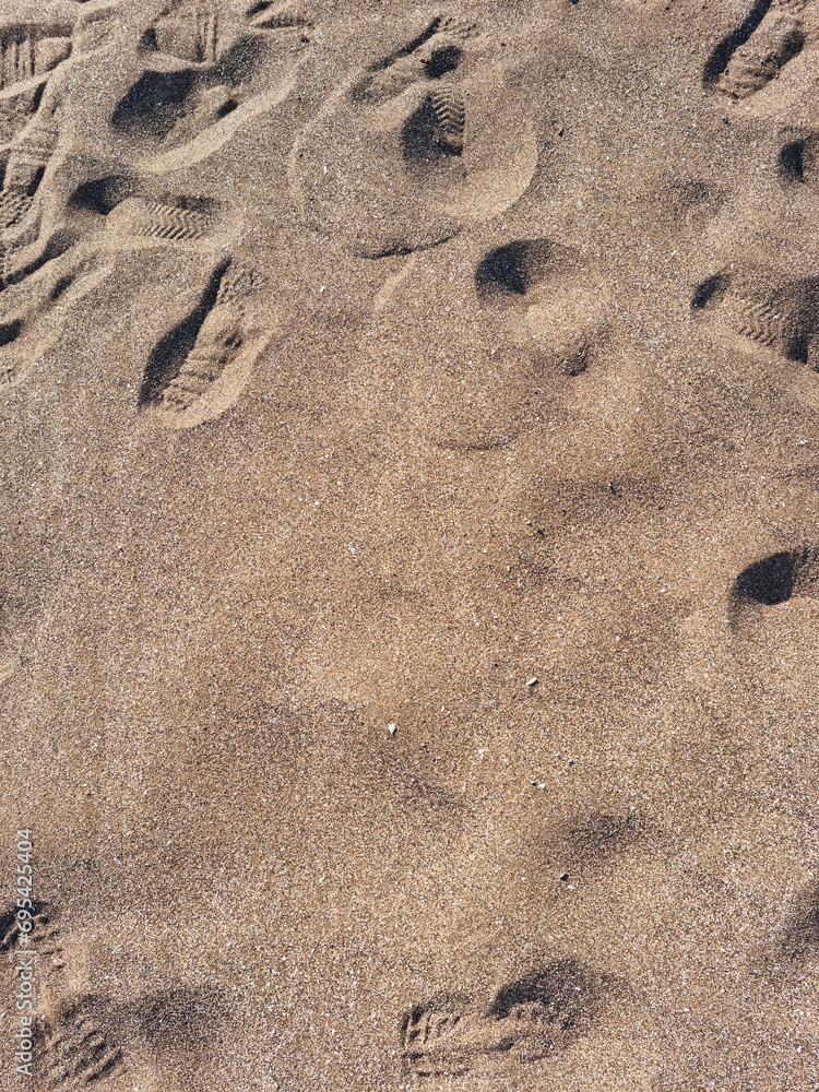 These are shoe prints in the sand.
These are shoe prints in the sand.