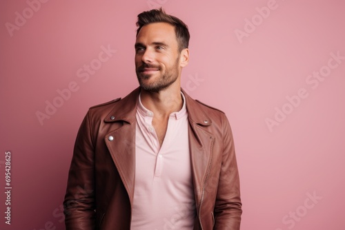 Portrait of a satisfied man in his 30s sporting a stylish leather blazer against a pastel or soft colors background. AI Generation