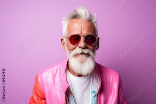 Portrait of a jovial man in his 70s wearing a trendy sunglasses against a pastel or soft colors background. AI Generation © Markus Schröder