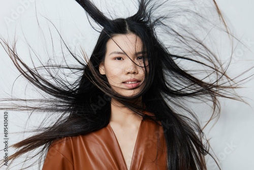 фотографія Woman asian beauty hair fashion glamour portrait beige