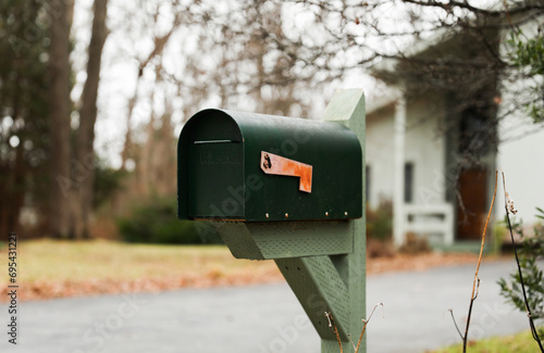mailbox outside suburban home, symbolizing communication and connection