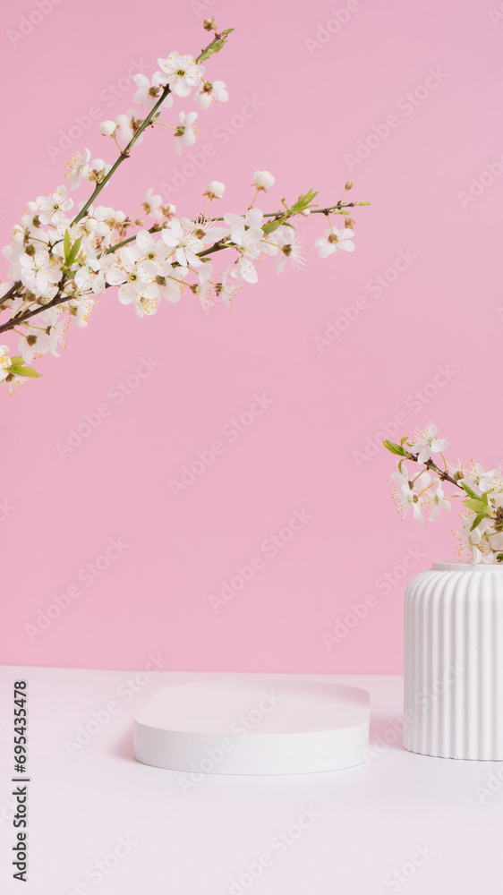 Empty podium or pedestal with spring bloom. Mock up for cosmetic products