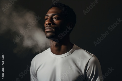 Portrait of a content afro-american man in his 30s sporting a breathable mesh jersey against a bare monochromatic room. AI Generation