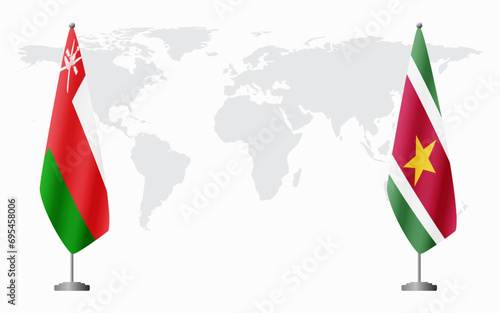 Oman and Suriname flags for official meeting