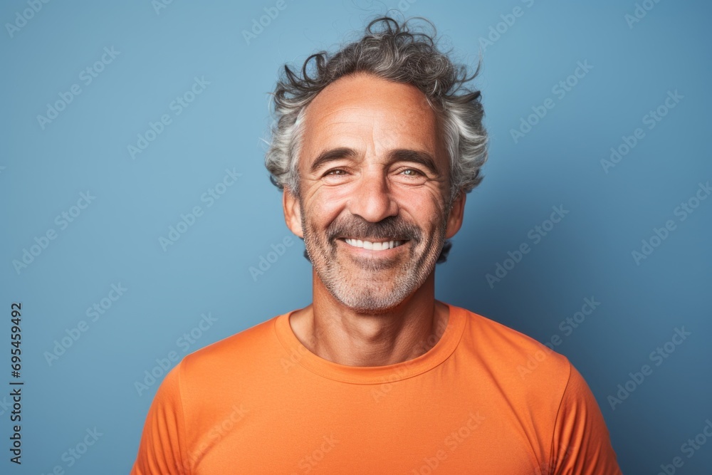 Portrait of a joyful man in his 50s sporting a breathable mesh jersey against a plain cyclorama studio wall. AI Generation Portrait of a joyful man in his 50s sporting a breathable mesh jersey against a plain cyclorama studio wall. AI Generation