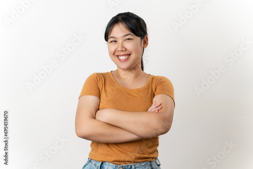 the pretty and happy Asian young woman is smiling confidently standing on a white background.