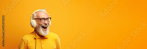 Portrait of cheerful elderly man with gray lush beard wearing white headphones, listening to music, song, humorous podcast, an audiobook on bright joyful yellow background. Copyspace. Generative AI photo