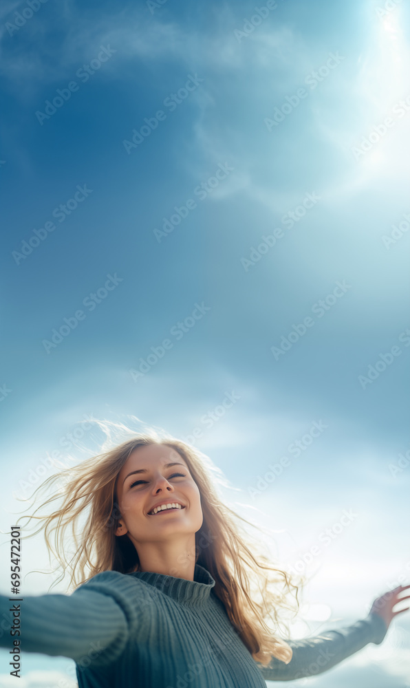 Female Smile in ocean breeze with sky background in optimism , wellbeing and success concepts Female Smile in ocean breeze with sky background in optimism , wellbeing and success concepts