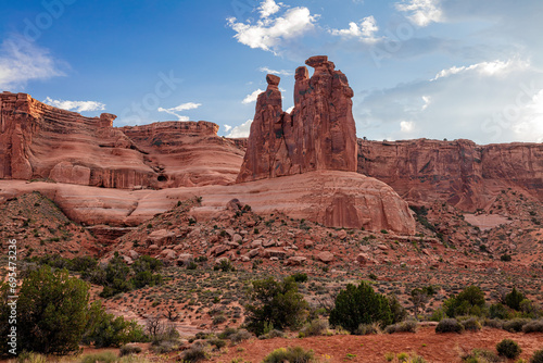Three Gossips rock formation at sunset in the desert landscape sandstone environment of Arches National Park Utah 