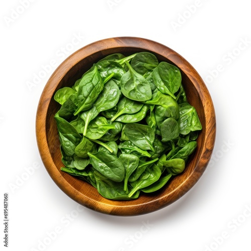 Fresh spinach leaf in wooden bowl on white background