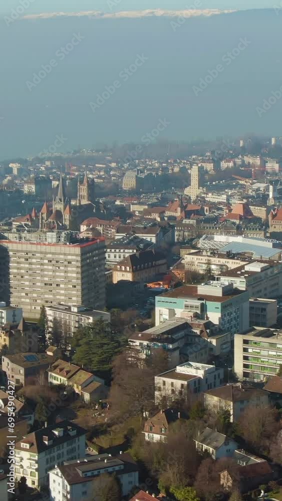 Lausanne City and Lake Geneva. Vaud, Switzerland. Aerial View. Drone Flies Sideways and Upwards. Vertical Video Lausanne City and Lake Geneva. Vaud, Switzerland. Aerial View. Drone Flies Sideways and Upwards. Vertical Video