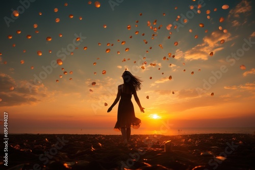  a woman in a dress standing in a field with balloons flying in the air in the air above her and the sun in the sky in the distance behind her.