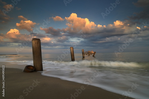 Inclined Column Beach, scenery view of the concrete columns from the old port with beautiful sky on Sao Iang Beach at Phetchaburi province,Thailand  photo