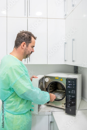 A dentist using machinery in his clinic