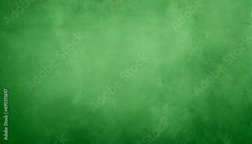 green textured paper or concrete wall wide banner background © Lauren