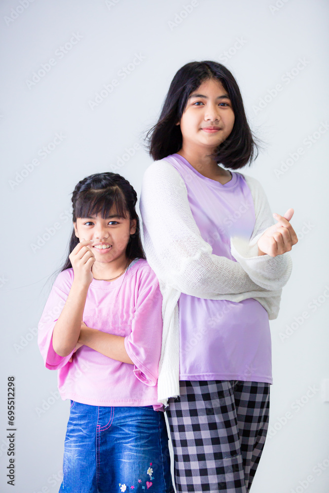 Asian sisters and sisters isolated white background,Two Asian women, white background Asian sisters and sisters isolated white background,Two Asian women, white background