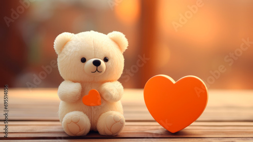 stuffed teddy bear with vibrant peach heart on wooden background