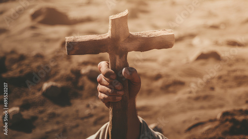 A hand firmly holding a cross, the concept of hope through christ, background for resurrection