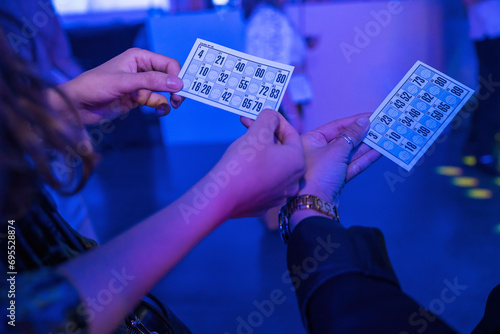 Women playing bingo at night