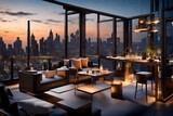 A high-rise hotel with a rooftop terrace, adorned with stylish furniture and overlooking a city aglow with city lights in the evening.
