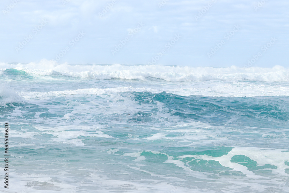 Fototapeta premium Blue big waves on the Atlantic ocean. The Praia da Ursa beach near Cabo da Roca (Cape Roca). The westernmost point of mainland Europe.