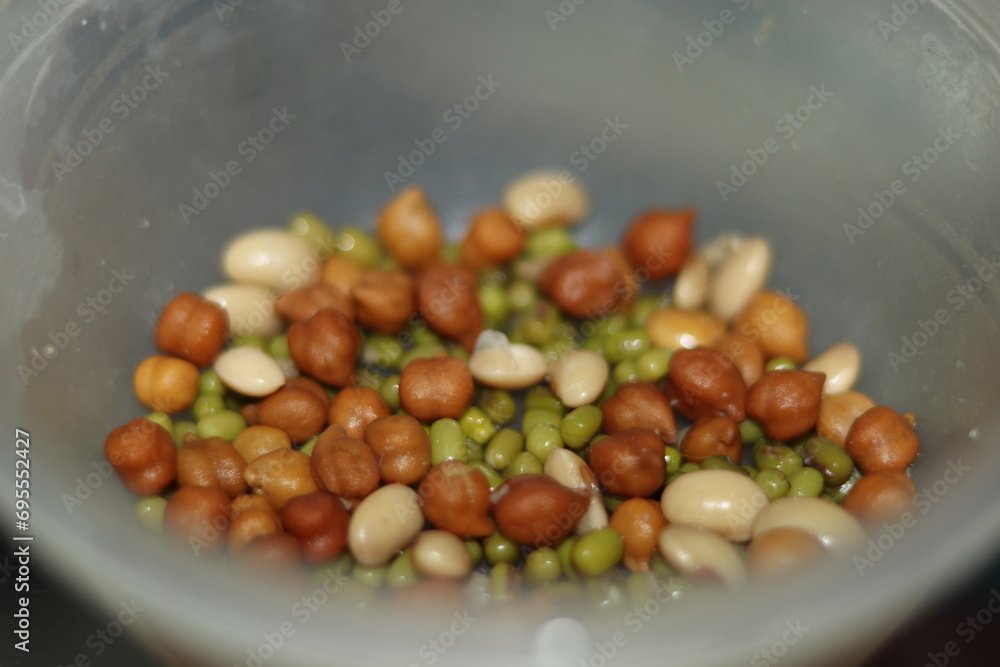 Mix of boiled Chickpeas Channa, green Pulse Moong Daal and White pulse Rajma in A plastic bowl for protein, selective focus Mix of boiled Chickpeas Channa, green Pulse Moong Daal and White pulse Rajma in A plastic bowl for protein, selective focus