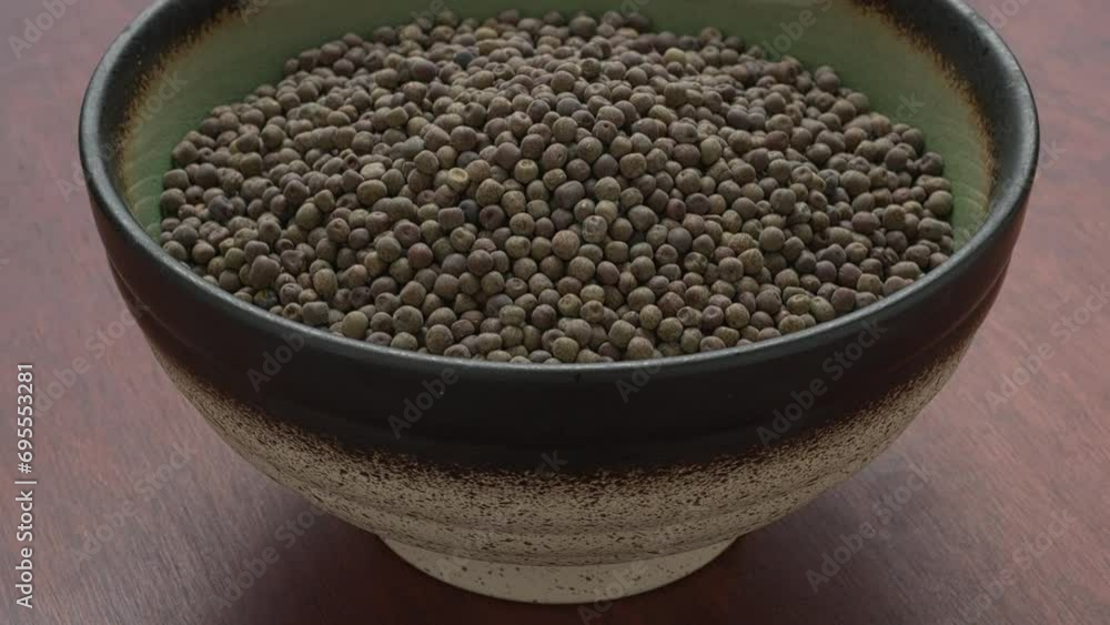 Dried whole Nepali peas (saano kerau) in bowl. Table spin. Dried whole Nepali peas (saano kerau) in bowl. Table spin.