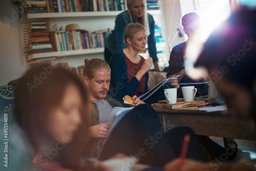 Group of students having study session at home photo