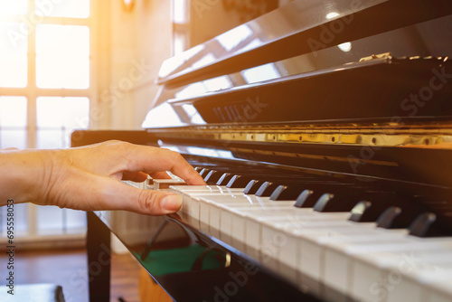 Fotografie Soft Focus and Blur,The pianist is fixing and adjusting the sound of the piano correctly and precisely so that the practice and performance of the piano will be melodious and without glitches