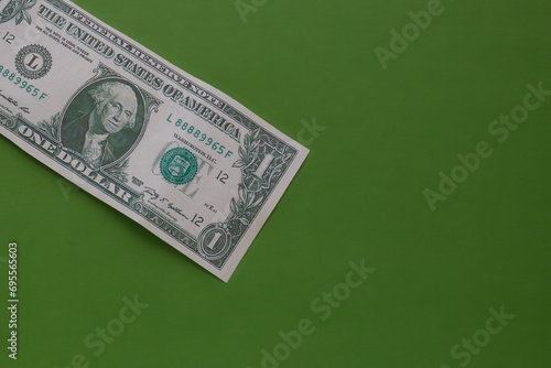 One dollar in top right corner of the frame on green background