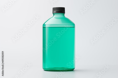 Plastic bottle with green liquid isolated on white background. Mock up. Close up