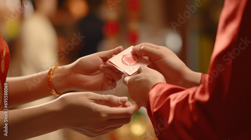 People exchanging red envelopes hongbao as gifts. photo