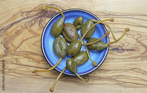 Картината върху платно Close-up of sicilian specialty snack pickled Cucunci caper apples fruits with st