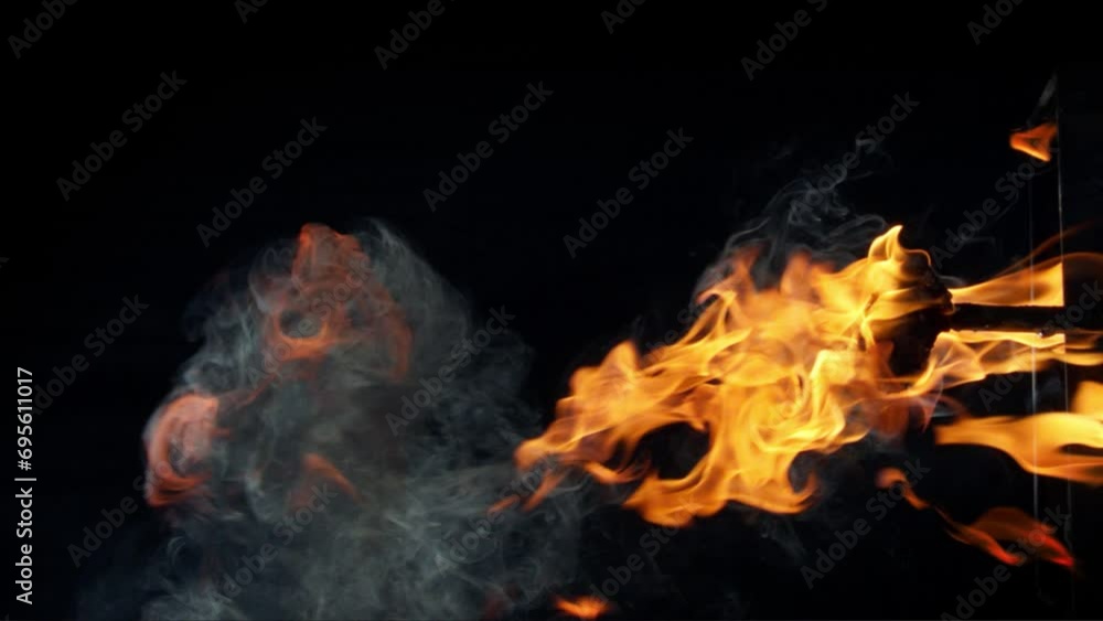 Real, slow-motion fire flames, smoke, sparks on a black background. Explosive, flaming nature of a campfire, blazing, burning elements, and fiery red flames captured. Real, slow-motion fire flames, smoke, sparks on a black background. Explosive, flaming nature of a campfire, blazing, burning elements, and fiery red flames captured.