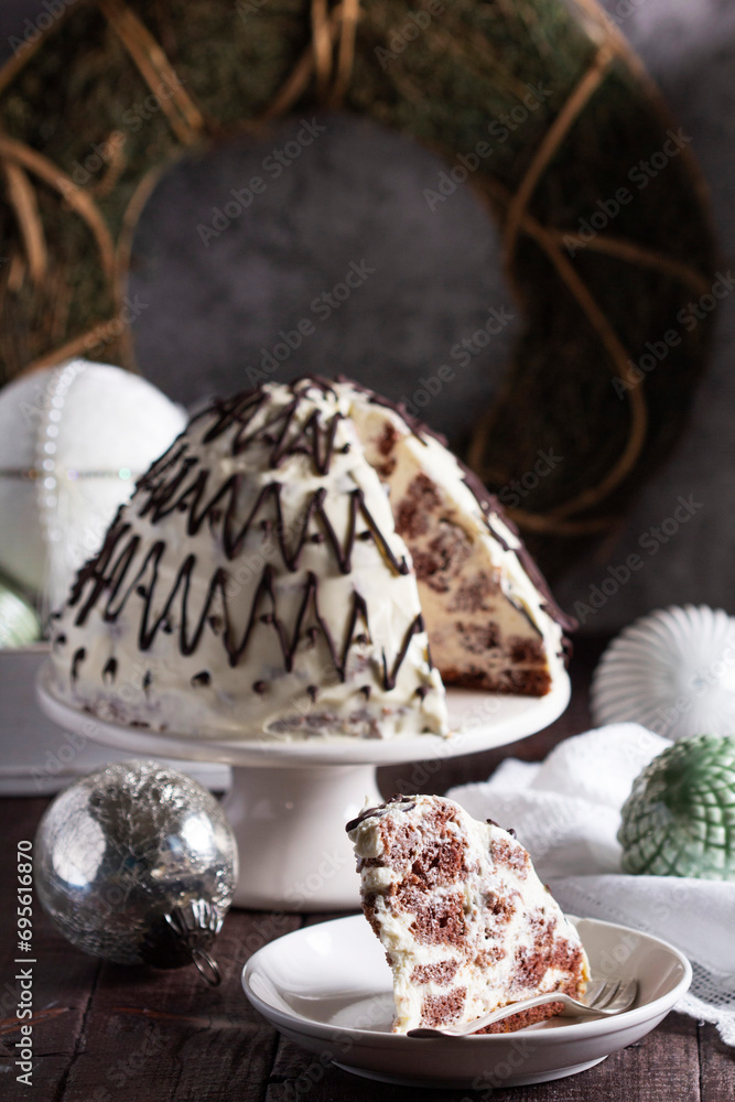Pancho cake made of chocolate biscuit with sour cream and pineapple in New Year's or Christmas decoration. Rustic style.
